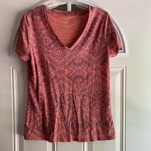 Print tribal design on peach shirt